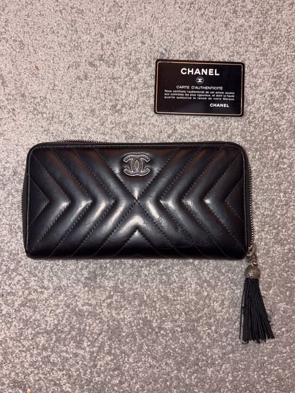 CHANEL Black Chevron Zip Around Tassel Wallet